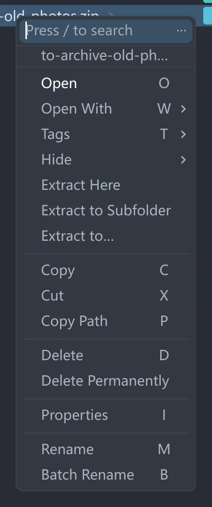 tessoa's right-click menu on a zip: Open, Tags, then the three extract entries, then Copy, Cut and the rest