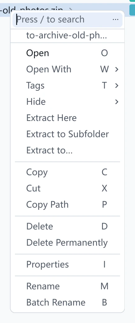tessoa's right-click menu on a zip: Open, Tags, then the three extract entries, then Copy, Cut and the rest