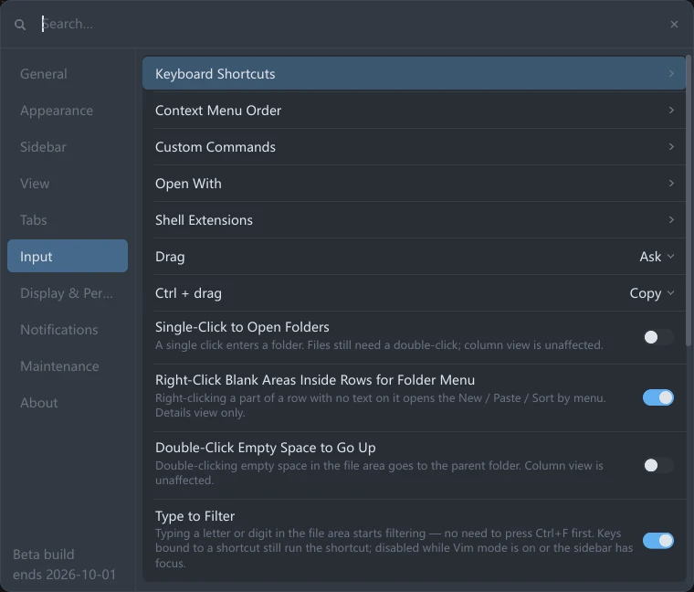 The Input group in tessoa's Settings panel: Keyboard Shortcuts, Context Menu Order, Custom Commands, Open With and Shell Extensions each ending in a ›, then the Drag and Ctrl + drag dropdowns, then the switches for Single-Click to Open Folders, Right-Click Blank Areas Inside Rows for Folder Menu, Double-Click Empty Space to Go Up, Type to Filter and Vim Mode