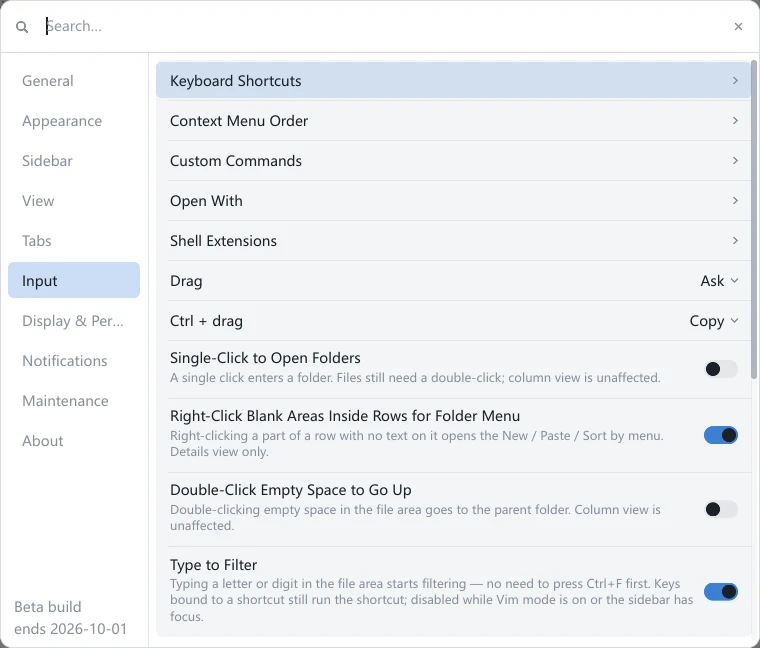 The Input group in tessoa's Settings panel: Keyboard Shortcuts, Context Menu Order, Custom Commands, Open With and Shell Extensions each ending in a ›, then the Drag and Ctrl + drag dropdowns, then the switches for Single-Click to Open Folders, Right-Click Blank Areas Inside Rows for Folder Menu, Double-Click Empty Space to Go Up, Type to Filter and Vim Mode